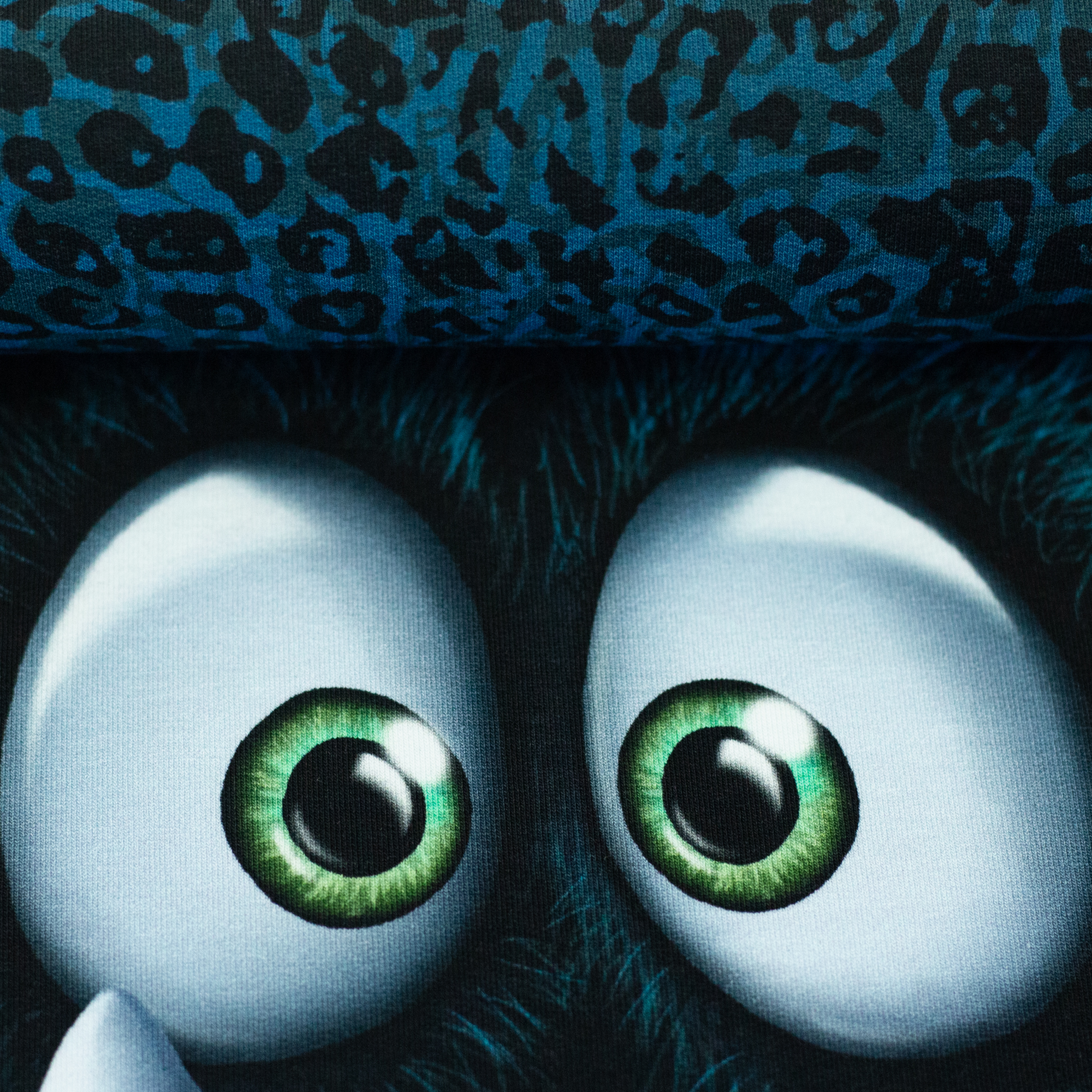 Monsta by Thorsten Berger in petrol, on the fabric bolt