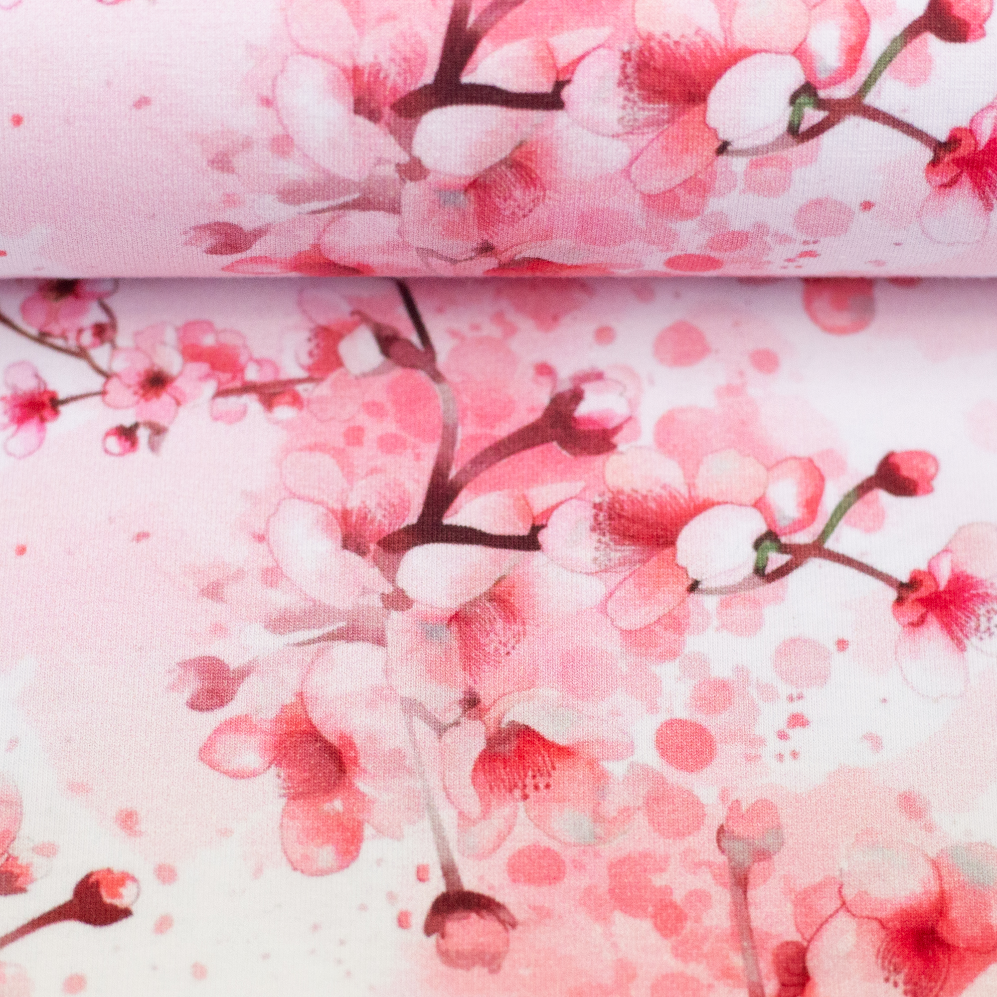 Hanami – Baumwolljersey in pink, auf dem Stoffballen